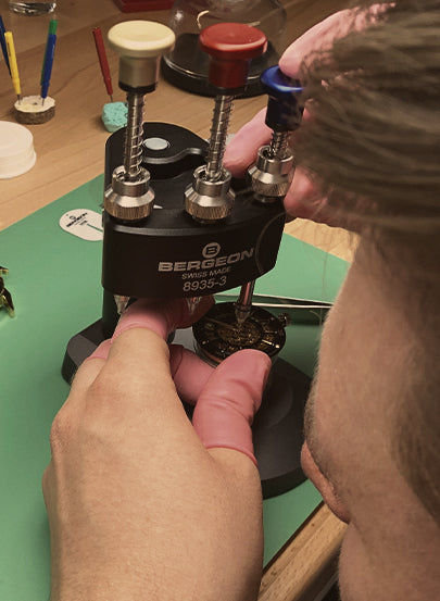 Tufina's watchmaker working at the laboratory in Munich, Germany. Hand assembly of the watch.
