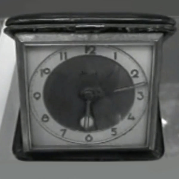 Vintage photo from 1920s of a traveler's pocket watch by Tufina