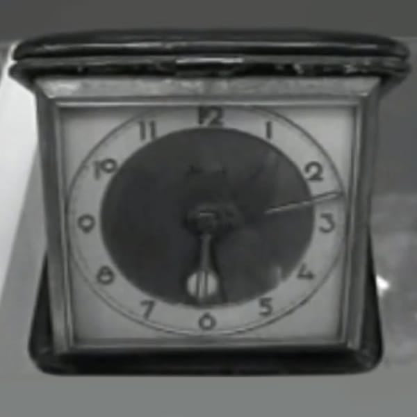 Vintage photo from 1920s of a traveler's pocket watch by Tufina