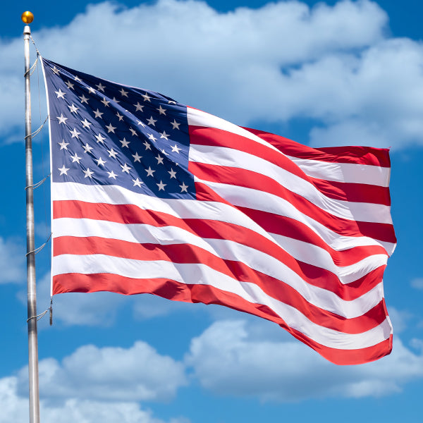 American flag with blue sky