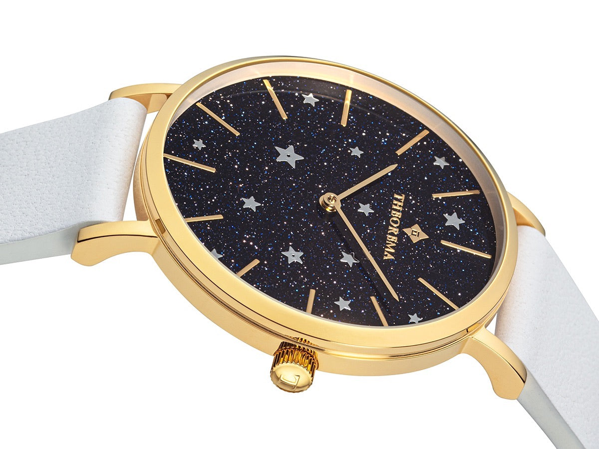 Gold color sticks as markers and Theorema logo under 12 a clock.