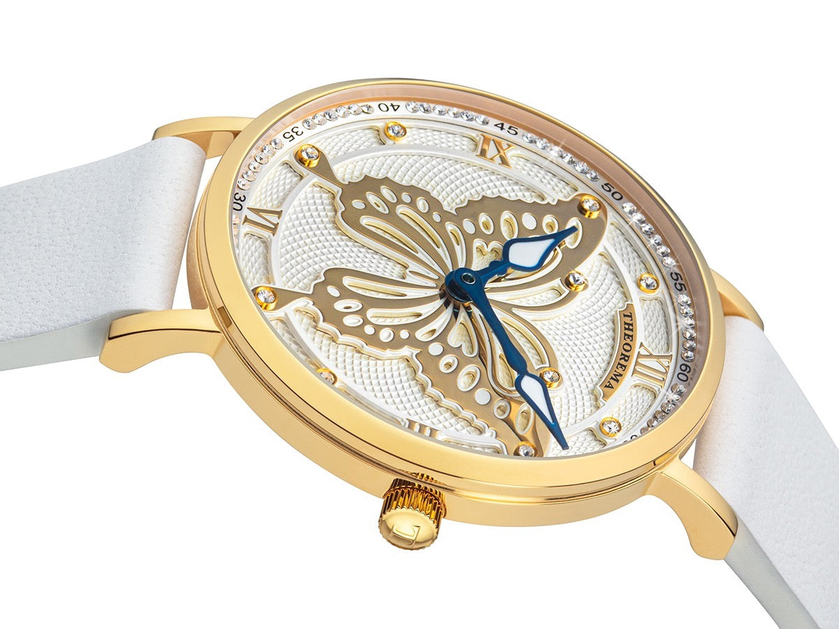 Multi tone dial with a big gold color butterfly in the middle and two hands in leaf shape.