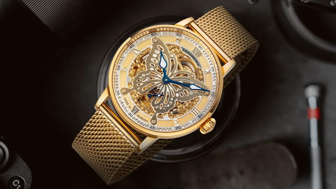 Tufina Madame Butterfly Theorema GM-123-8 automatic watch for women, luxury watch for women made in Germany, skeleton dial watch with gold case and mesh bracelet