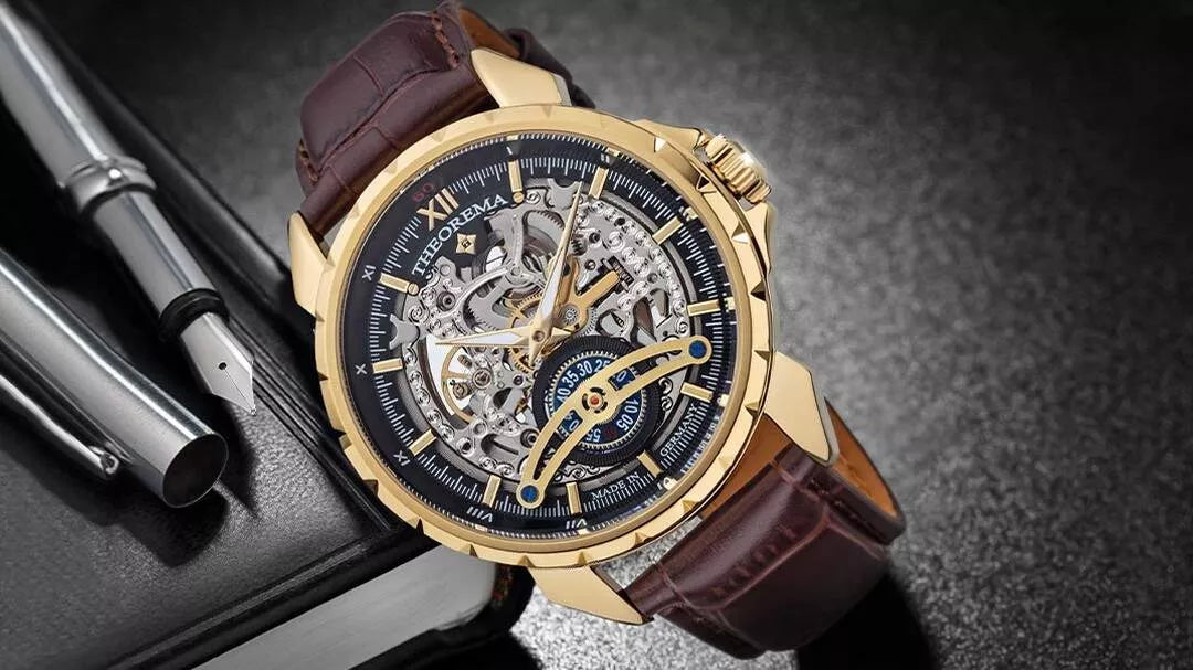 Tufina gold skeleton wristwatch with black dial, exposed movement, and brown leather strap, placed beside a pen and notebook on a dark surface.