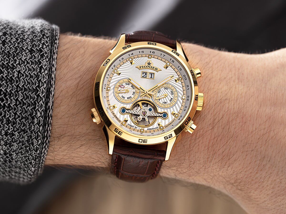 White dial Florida collection showcased on a man's wrist.