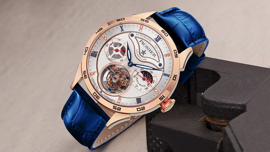 White dial tourbillon with rose color case and blue genuine leather band.