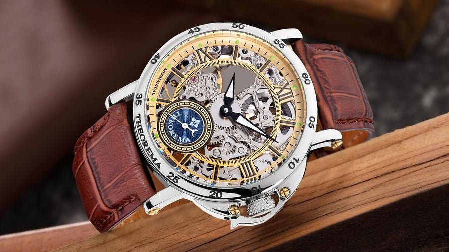 Open face skeleton dial with silver case and brown leather band.