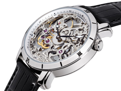 See-through skeletonized dial with silver case and black leather band.