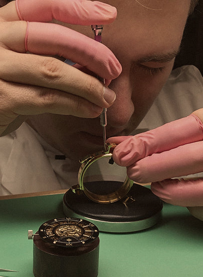 Tufina's watchmaker working at the laboratory in Munich, Germany. Hand assembly of the watch.