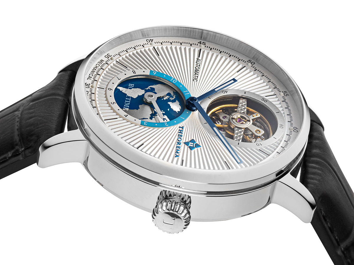 Multi pattern white dial with open heart design and blue hands.