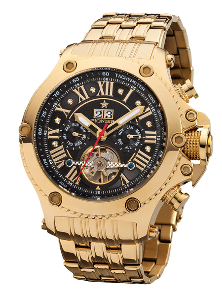 Gold wristwatch with a black dial face on a white background.