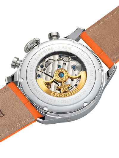 Open glass back that showcases the mechanism inside along the gold color rotor.