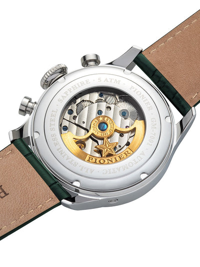 Silver case with silver buttons and an engraved gold color rotor with Pionier logo on it.