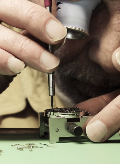 Tufina's watchmaker working at the laboratory in Munich, Germany. Hand assembly of the watch.