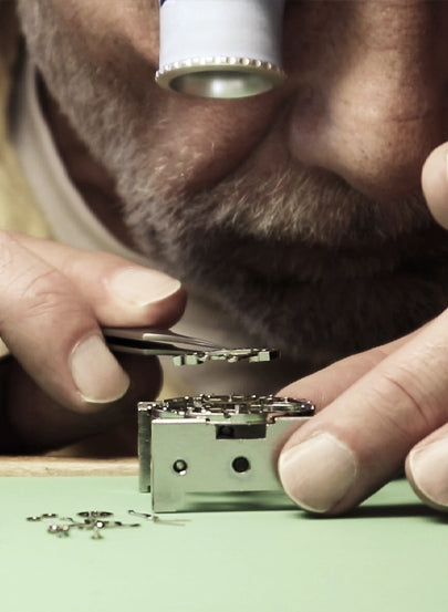Tufina's watchmaker with a loop in his eye hand assembly process 