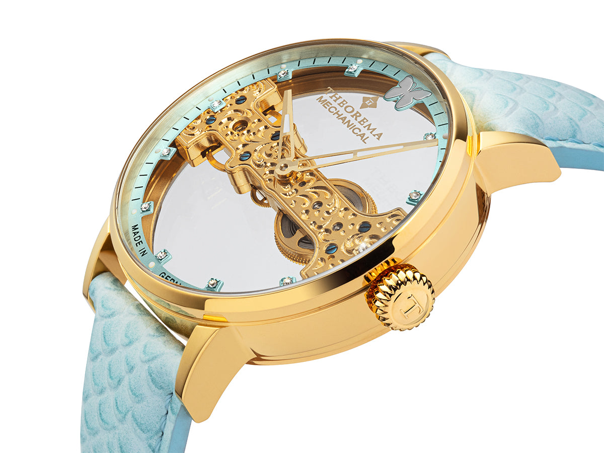 11 Swarovski's on the bezel and gold case with light blue genuine leather.