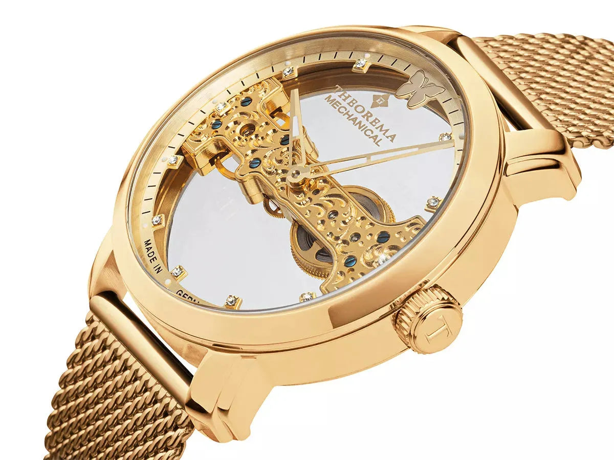 11 Swarovski's on the bezel and gold case with gold stainless steel band.