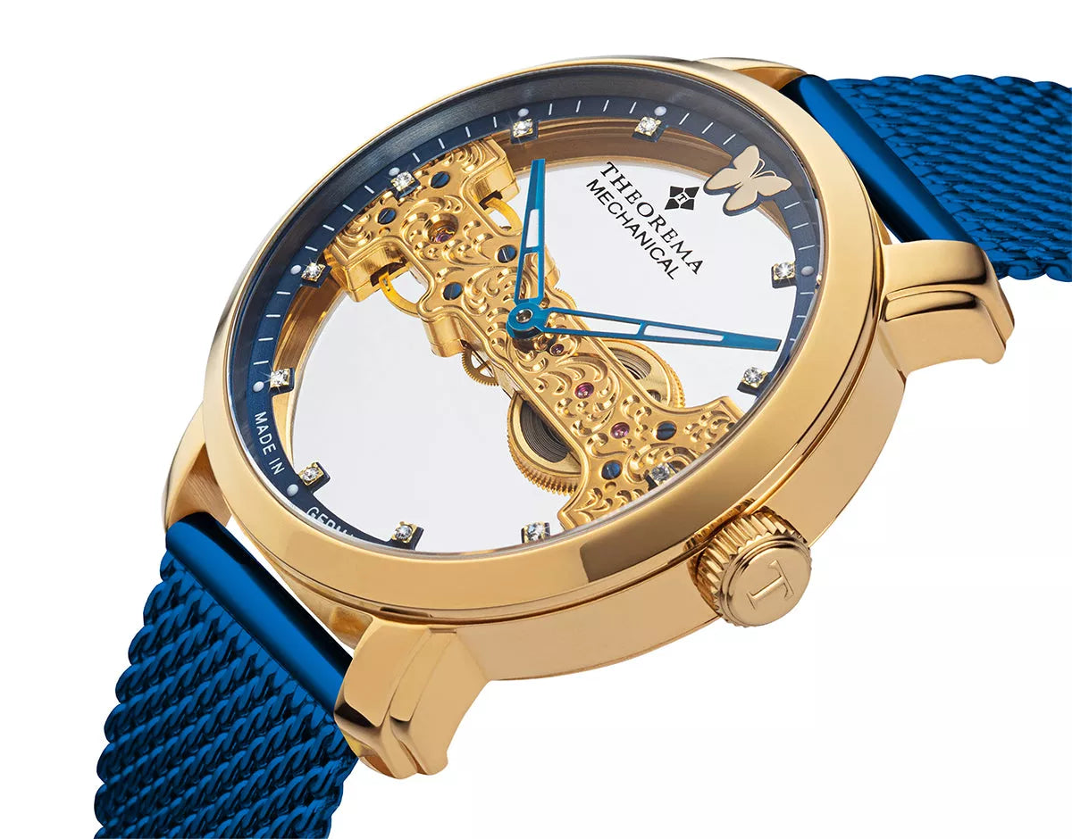 11 Swarovski's on the bezel and gold case with blue stainless steel band.