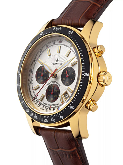 White dial with 3 sub dial design in a gold case and brown leather band.