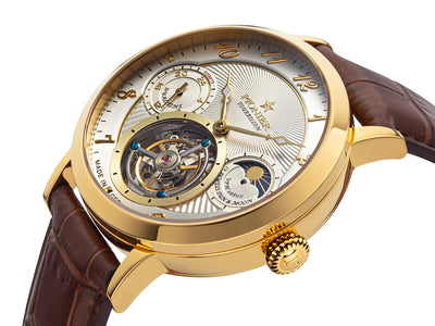 White dial with open heart design and arabic numerals with gold case.