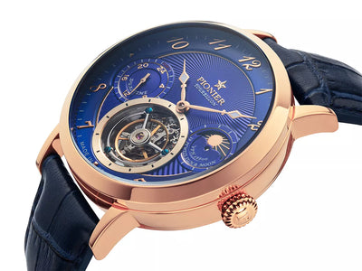 Blue dial with open heart design and arabic numerals with rose case.
