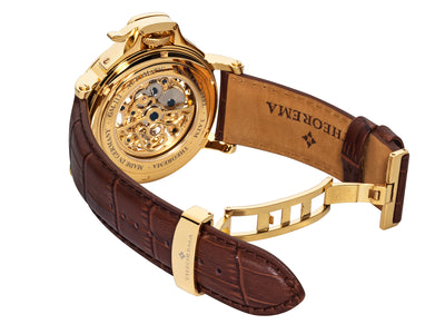 Open back case with gold color mechanism with all gears visible and deployment buckle for the band.
