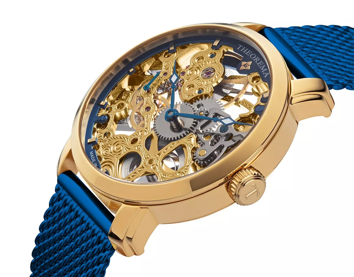 Gold dial with gold case and gold button and blue stainless steel band.