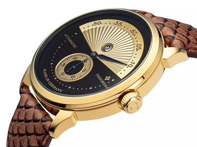 Roman numerals watch with gold case and gold crown button.
